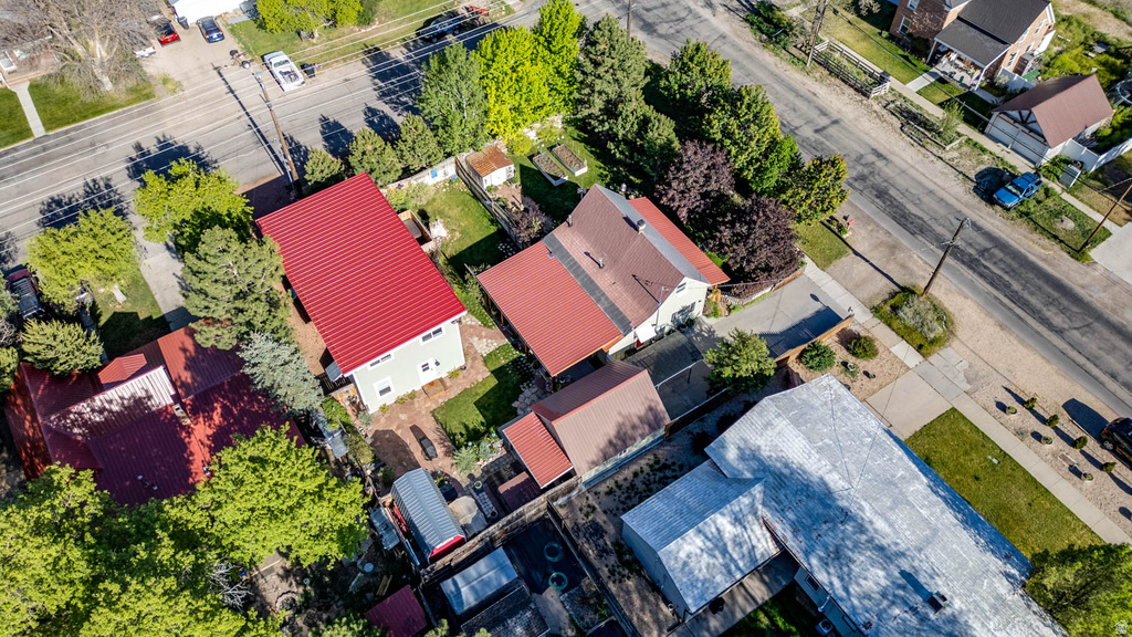 Aerial overview showcasing a property with a vibrant red metal roof