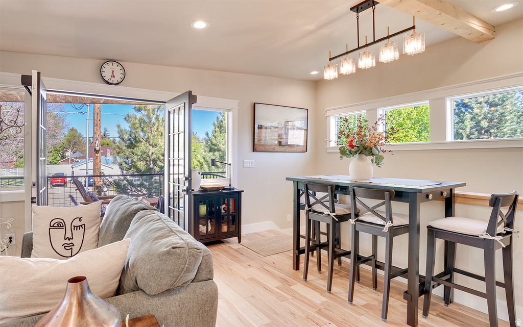Open concept living space featuring wide plank wood-finish flooring