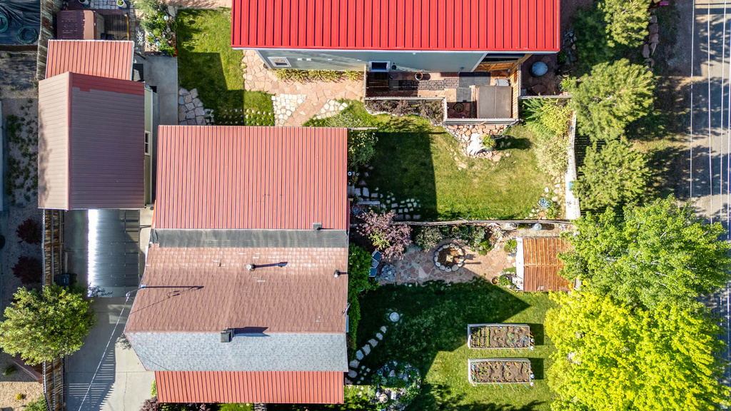 Aerial overview featuring multiple properties with red metal roofing