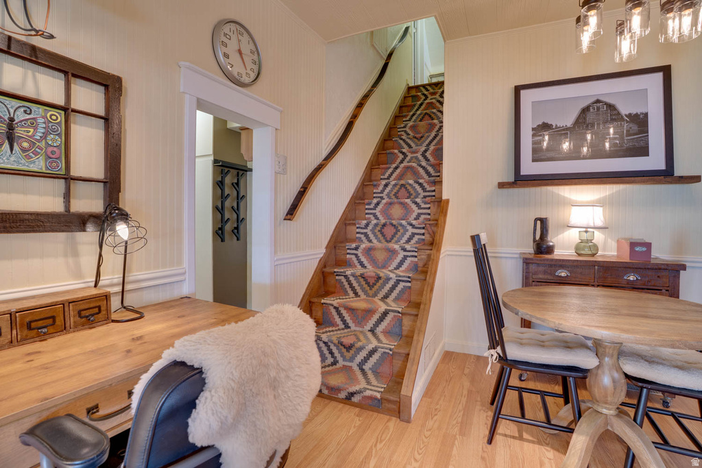 Hardwood flooring complements a staircase with a patterned runner