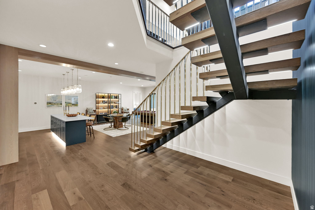 Modern open-tread staircase with metal stringers and wood steps