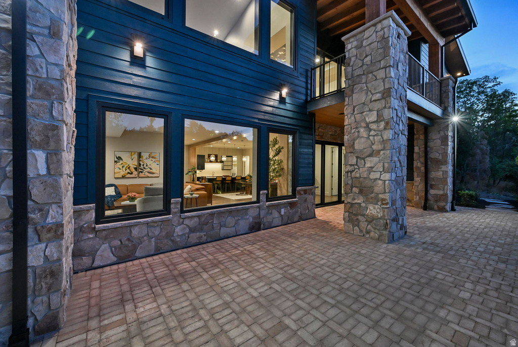 Stone-accented exterior with dark blue siding