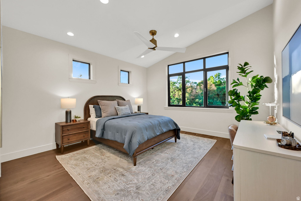 Bedroom featuring vaulted ceilings and recessed lighting
