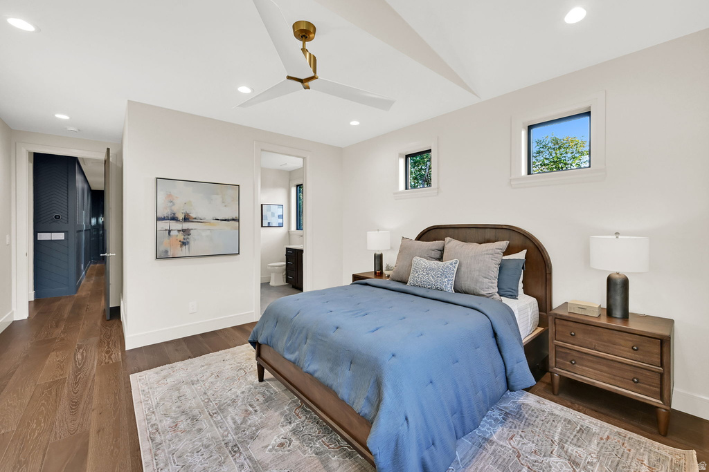 Spacious room featuring wood-finish flooring, recessed lighting, and a contemporary ceiling fan