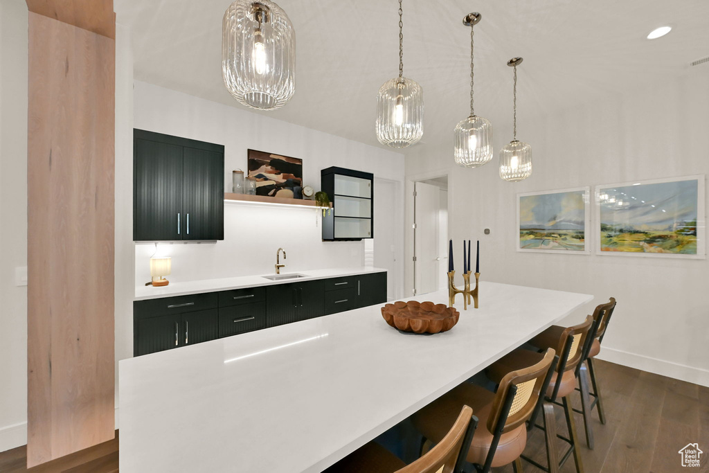 Spacious island featuring a white countertop and seating for four