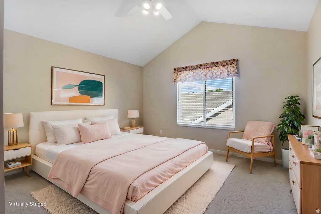 Bedroom featuring a vaulted ceiling and neutral wall tones