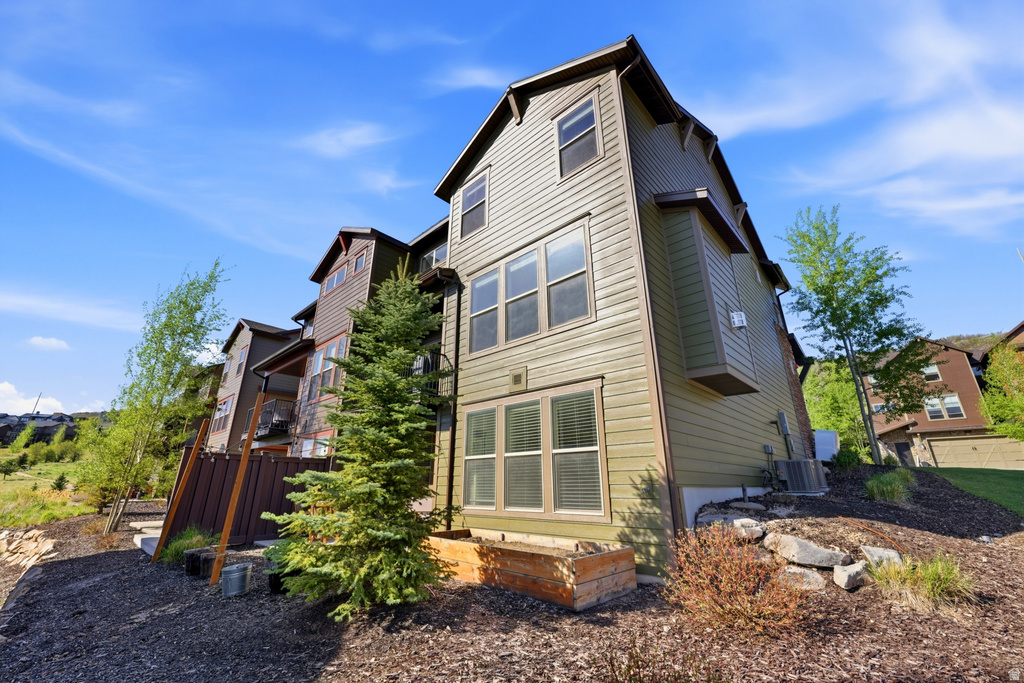 Multi-level exterior with horizontal siding and multiple windows