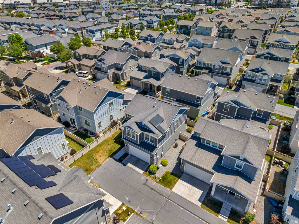 Aerial perspective of a contemporary residential neighborhood featuring uniform rooflines and diverse exterior siding colors