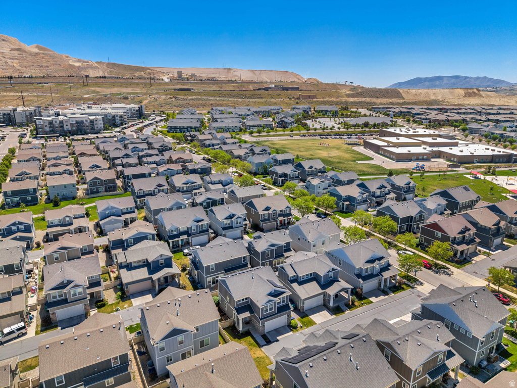 Aerial view showcasing a residential community with varied architectural styles and multi-story homes