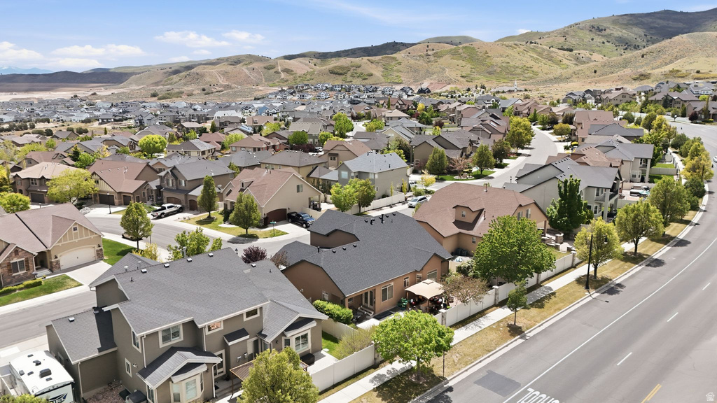 Expansive neighborhood featuring numerous residential properties with diverse architectural styles, asphalt shingle roofs, and established landscaping