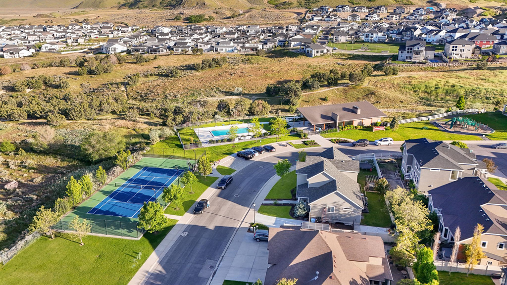 Residential community featuring a tennis court, swimming pool, and playground