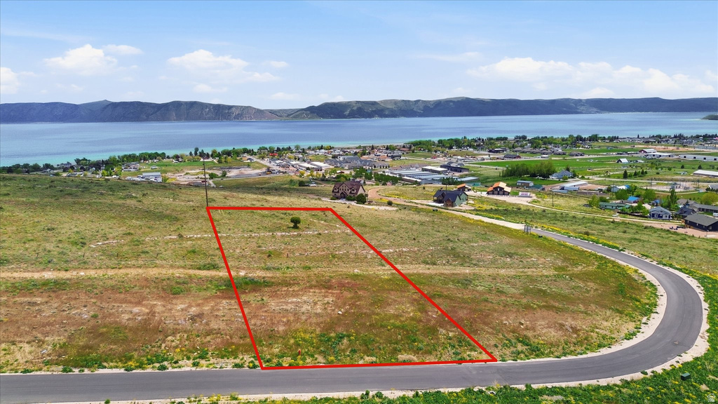 Land parcel with road frontage and visible lake beyond