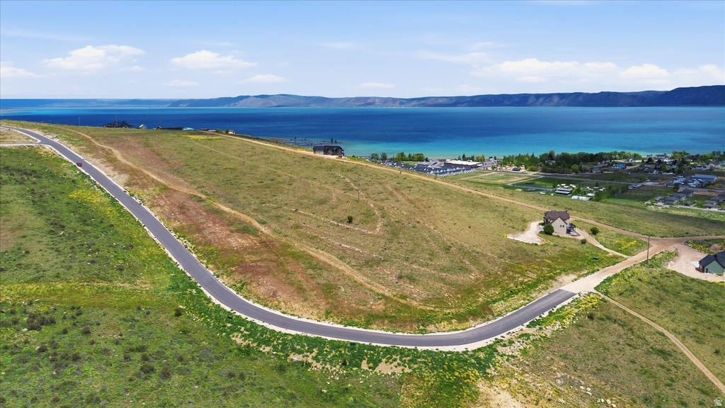 Undeveloped land with undulating terrain and lake frontage view