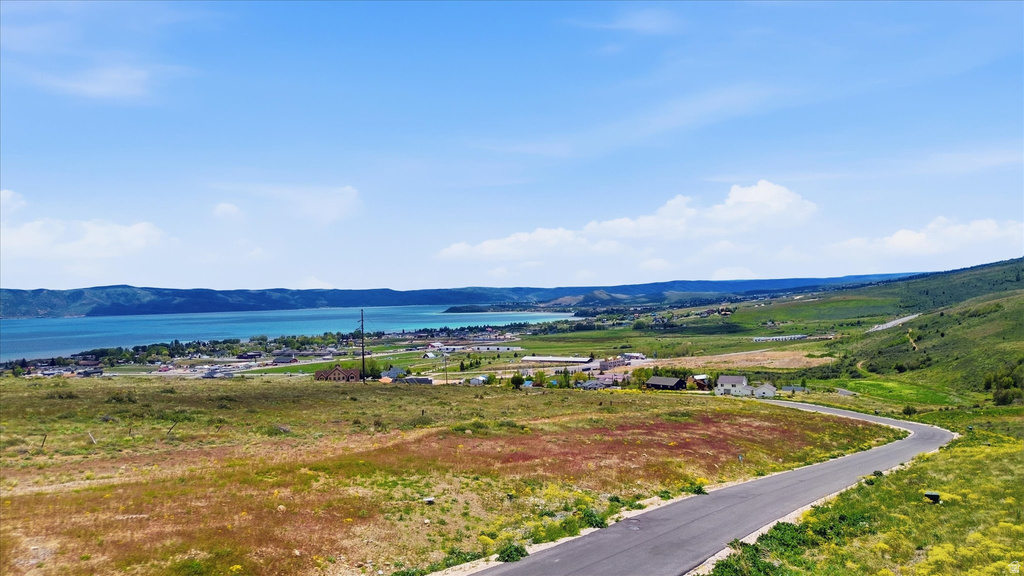Elevated homesite with rolling green hills and distant water