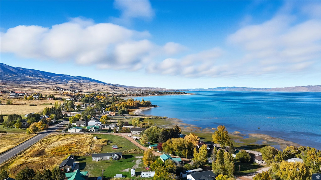 Bear Lake shoreline with foliage and surrounding hills