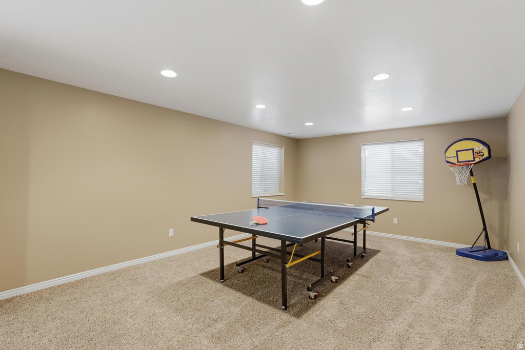 Spacious room featuring neutral carpeting and recessed lighting