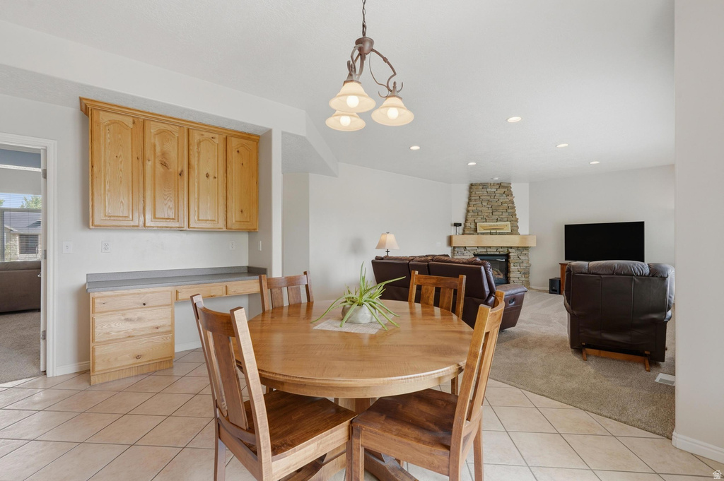 Tiled flooring, built-in cabinetry, and a dedicated desk area create a functional space