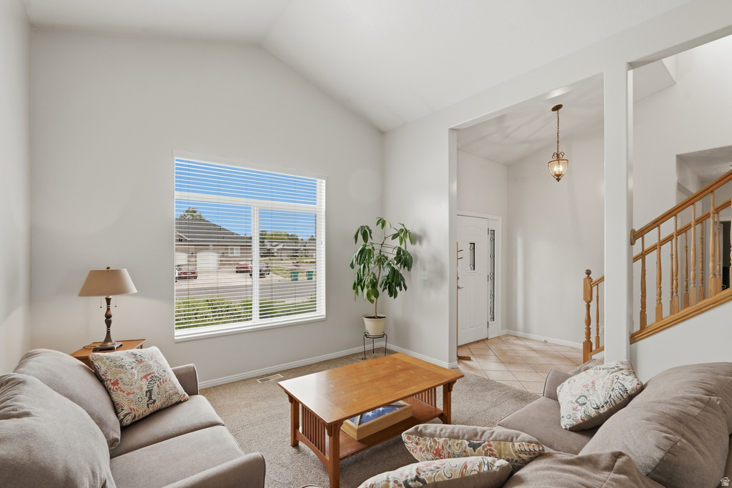 Living area with vaulted ceilings and large window
