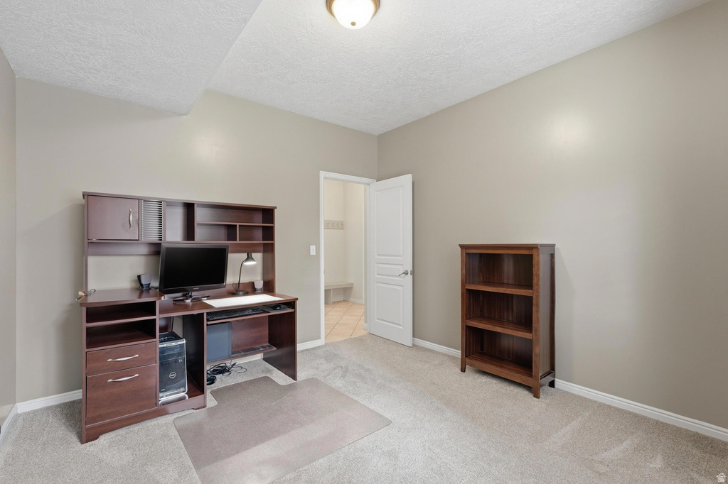Neutral-toned room with light carpet flooring