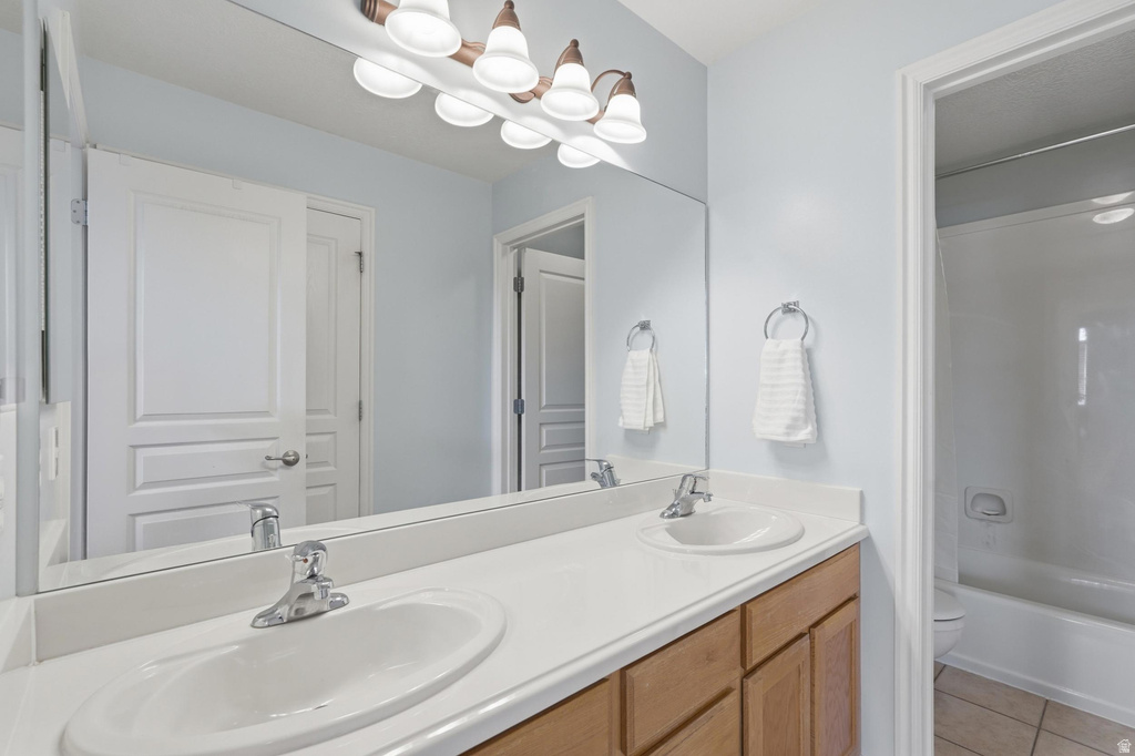 Double vanity featuring integrated sinks and chrome fixtures