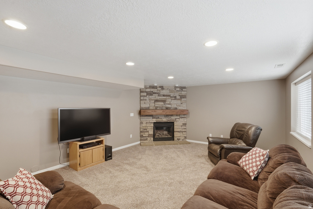Stone-clad fireplace with a wood mantel