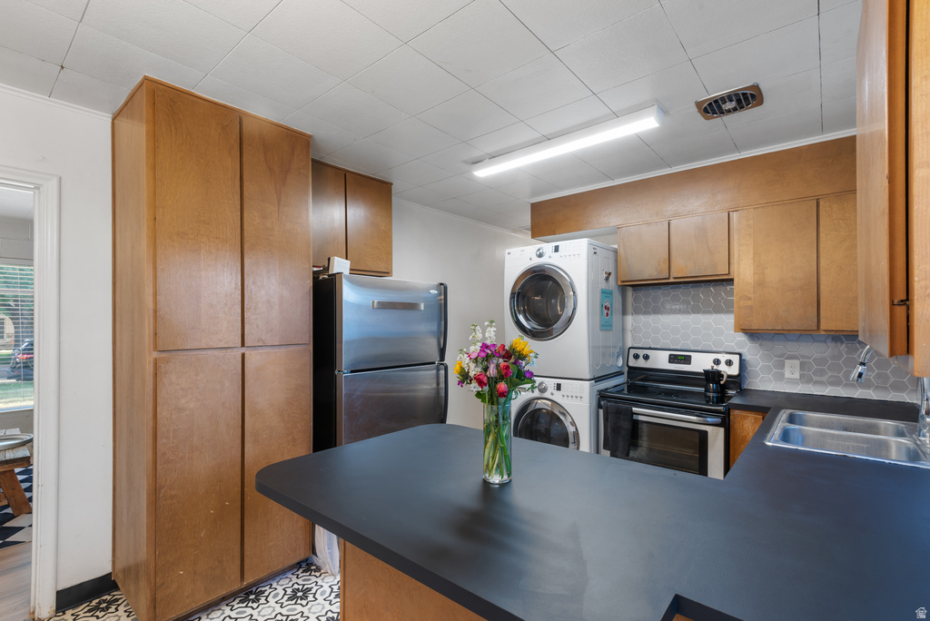 Kitchen with wood-finish cabinetry and black countertops