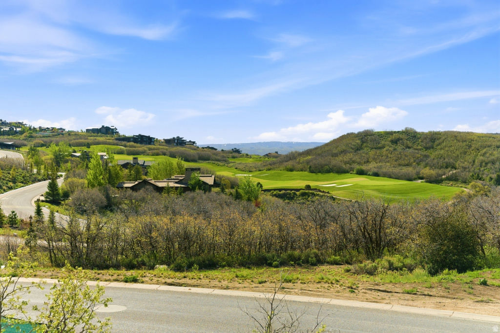 Expansive golf course and distant mountain scenery