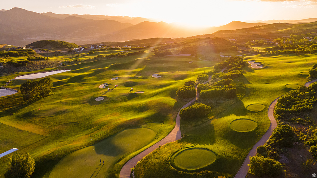 Expansive golf course featuring multiple greens, sand traps, and cart paths