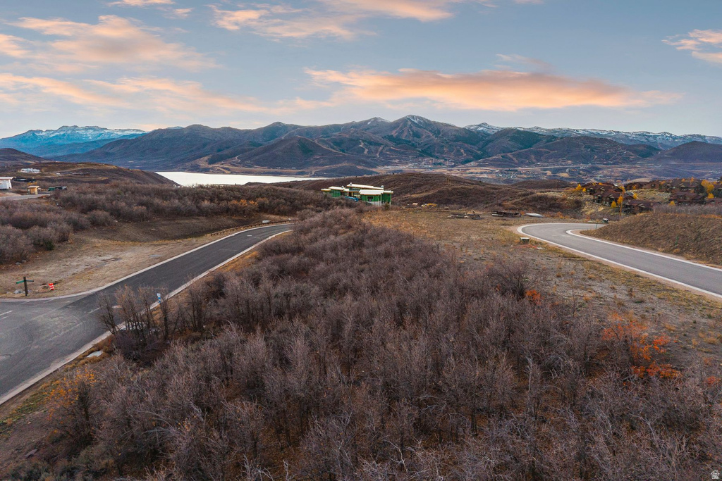 Paved roads winding through a natural landscape, offering mountain and water scenery