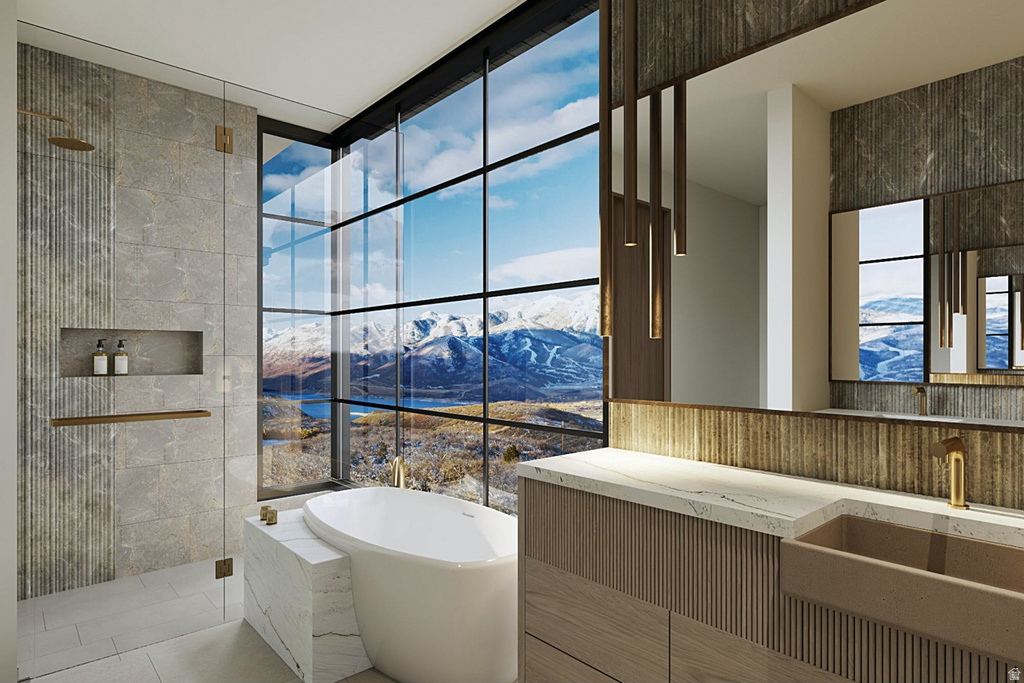 Floor-to-ceiling windows with grid patterns frame a mountain and water scenery