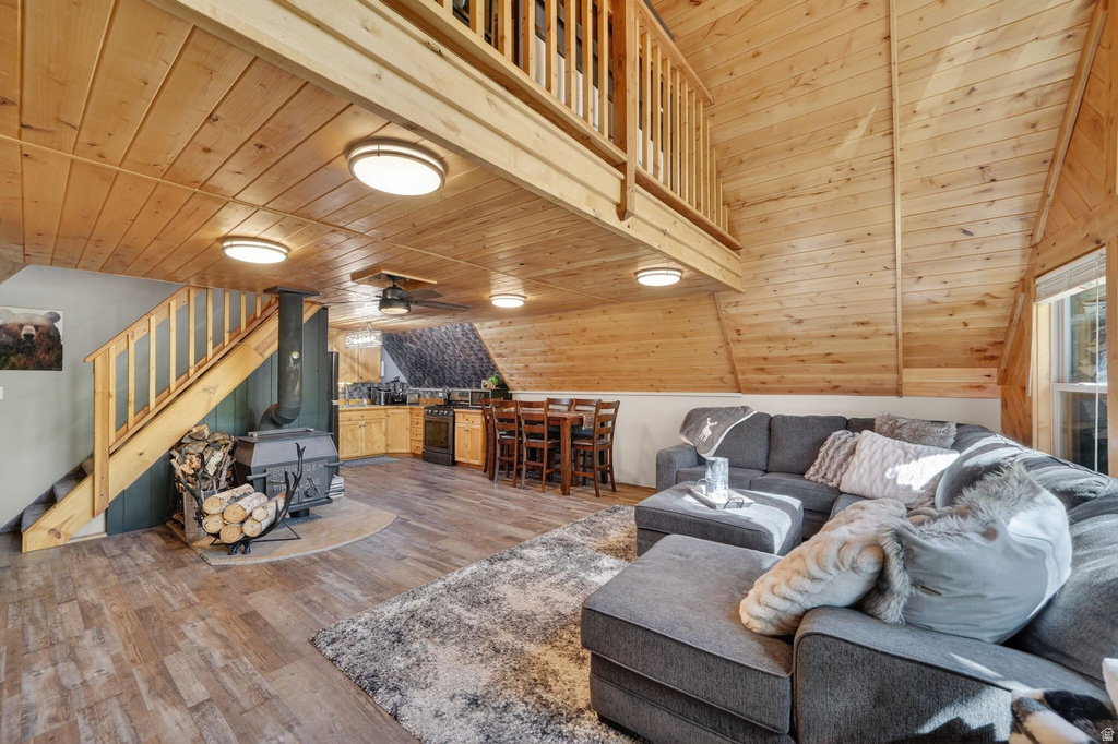 Open concept interior featuring natural wood-finish walls and ceilings