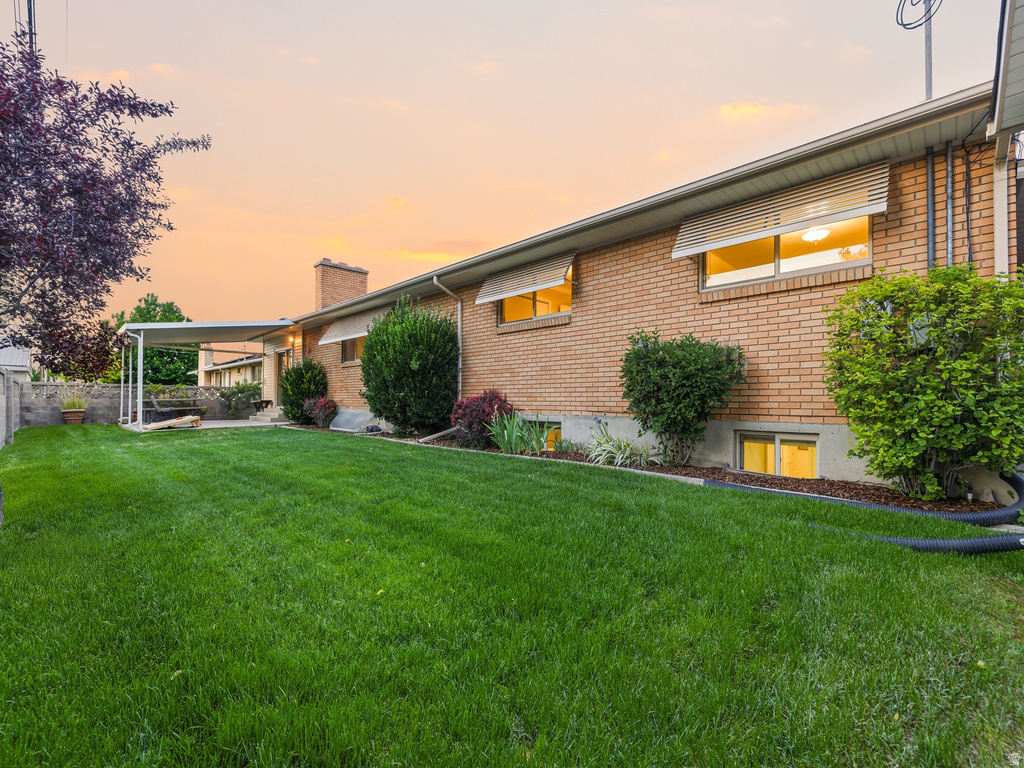 Expansive green lawn with mature landscaping