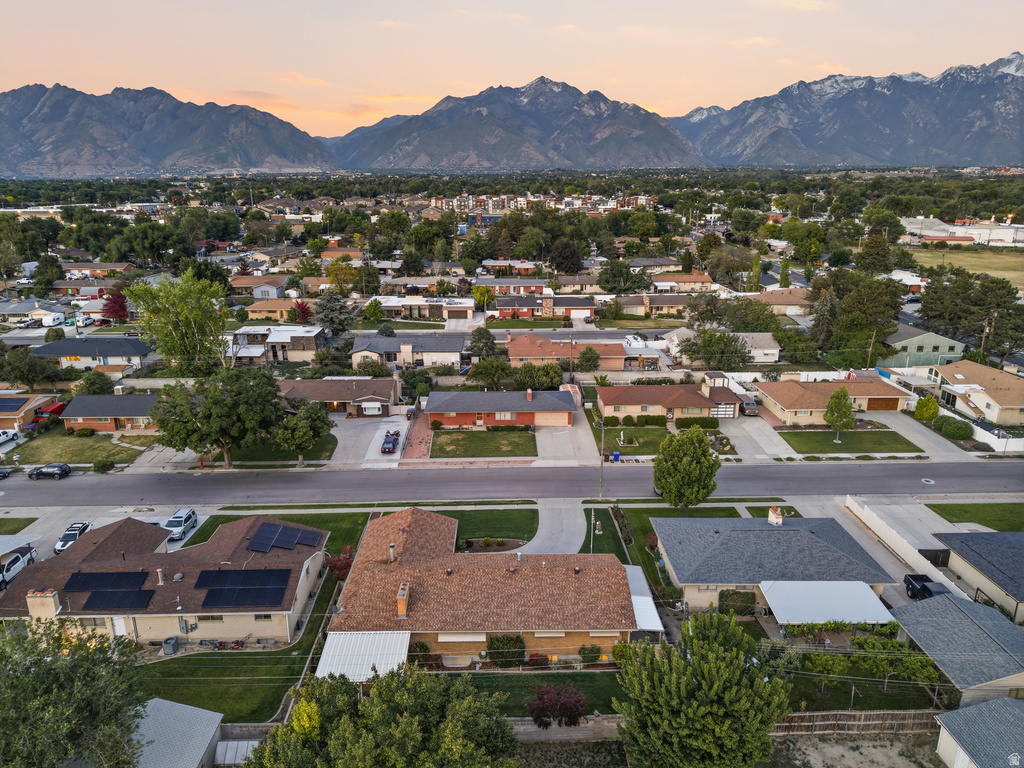 Aerial perspective showcasing a residential neighborhood with a distant mountain range