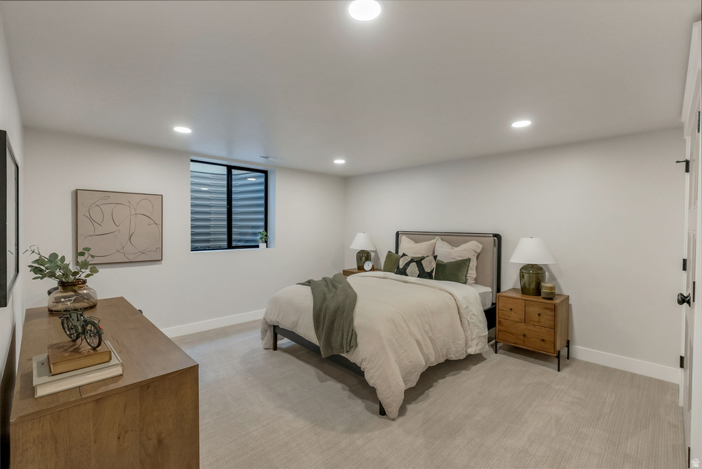 Carpeted room with recessed lighting and a window featuring horizontal blinds