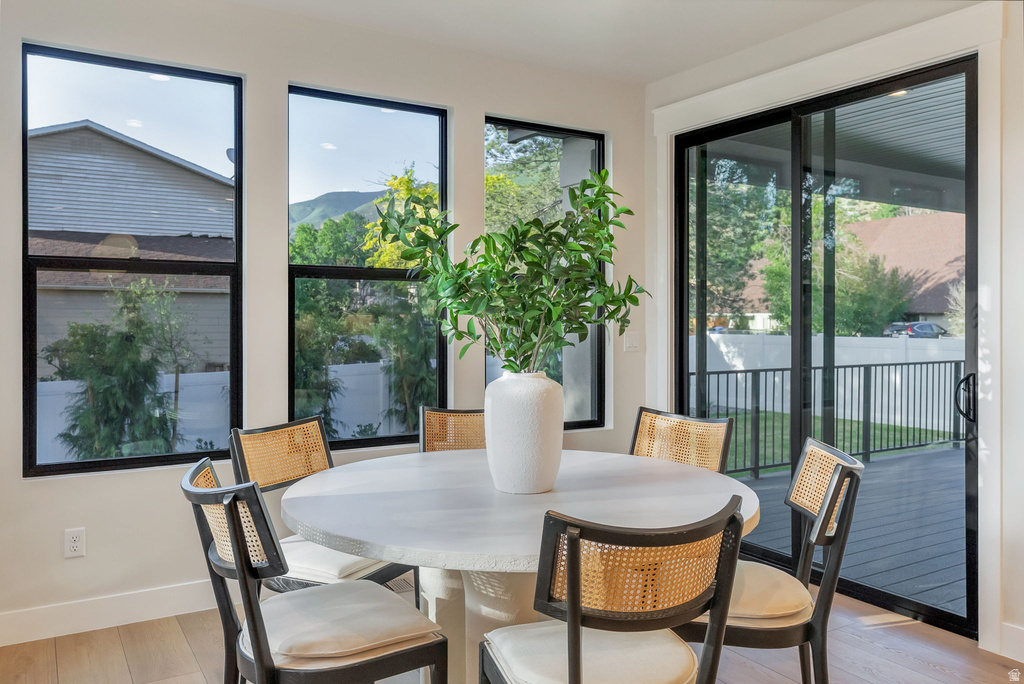 Light wood-finish flooring complements the neutral wall color