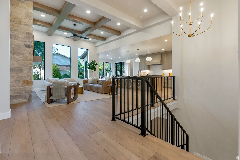 Open-concept living space with expansive wood-finish flooring
