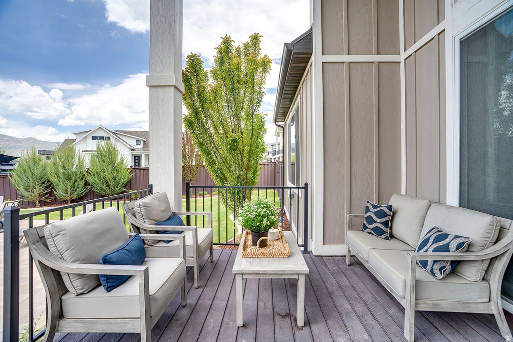 Covered outdoor patio featuring wood-finish decking