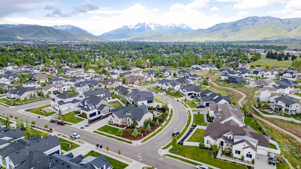 Expansive residential development featuring contemporary homes with dark-pitched roofs and light-colored siding