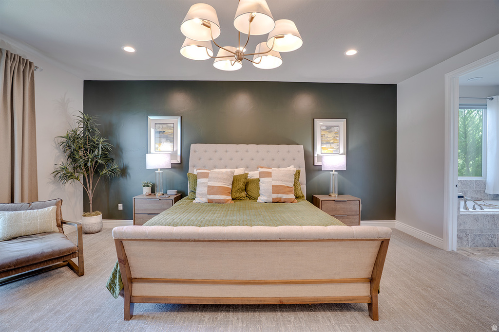 Spacious room featuring wood-finish flooring, recessed lighting, and a chandelier with fabric shades