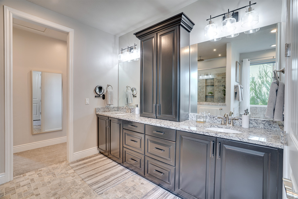 Dual vanity with under-mount sinks and stone countertops
