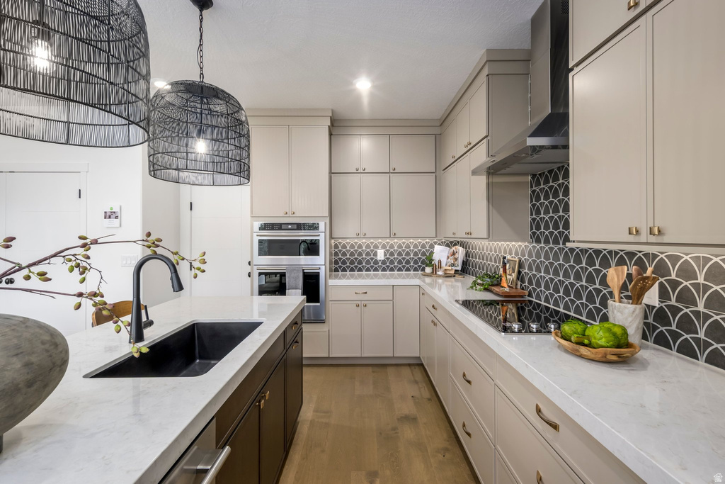Contemporary kitchen with light wood-finish flooring