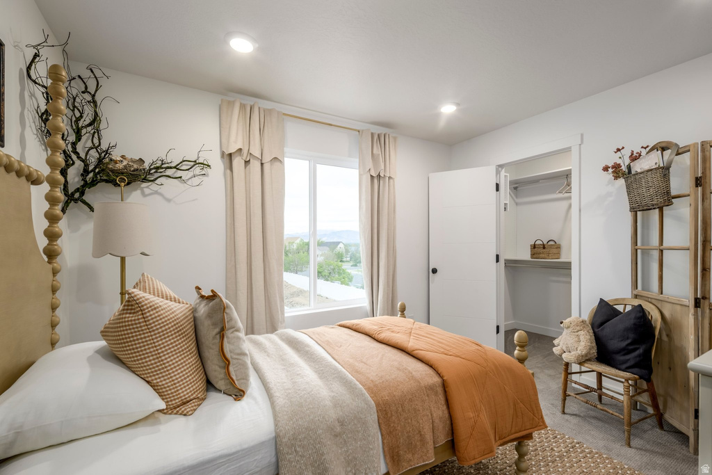Brightly lit room featuring a white interior, recessed lighting, and a window with light-colored drapes