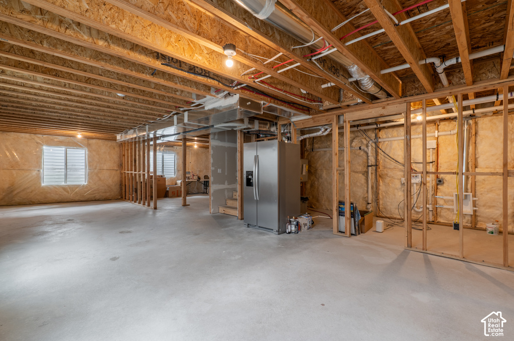 Spacious unfinished basement offering significant potential for customization