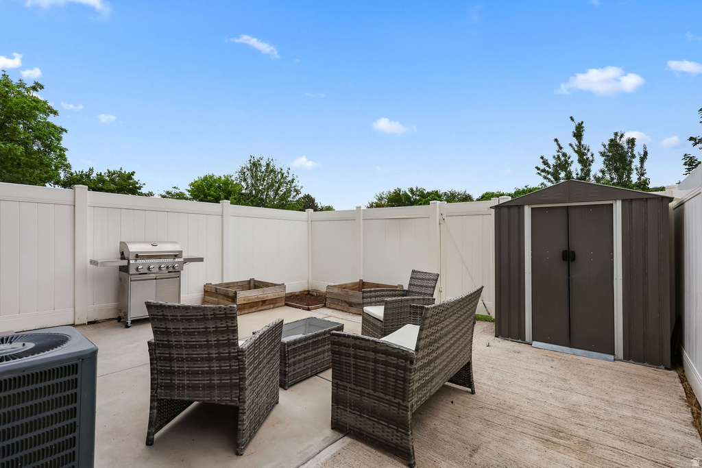 Concrete patio space enclosed by a perimeter fence