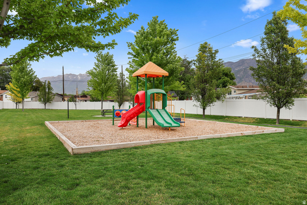 Outdoor play structure featuring multiple slides and an elevated platform