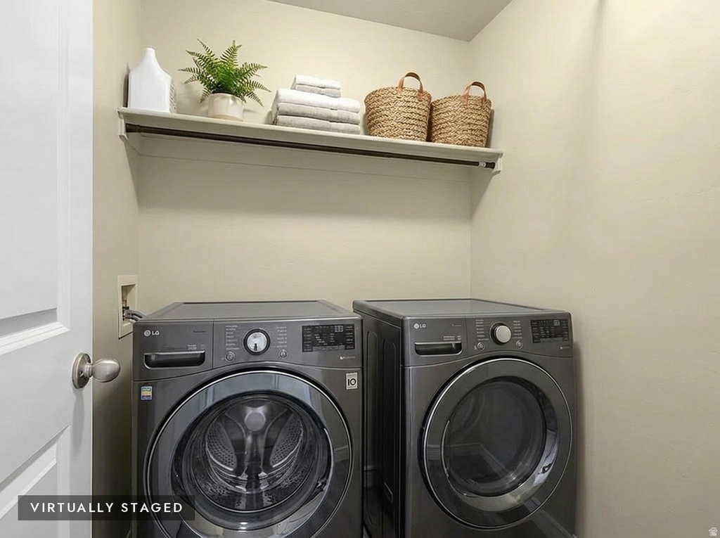 Dedicated laundry space featuring a white wall shelf, neutral wall tones, and space for side-by-side appliances