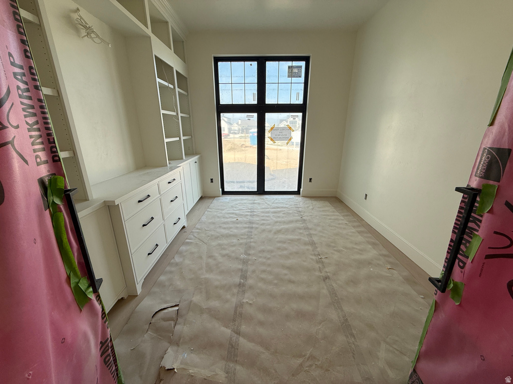 Built-in cabinetry with shelving, drawer storage, and a work surface