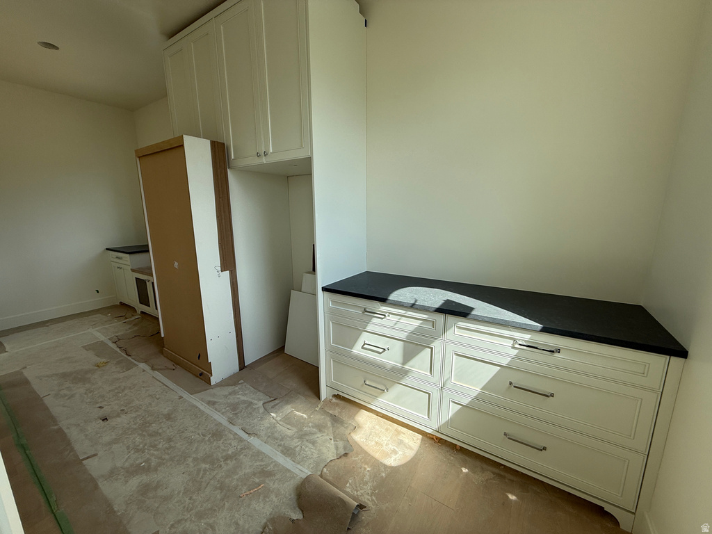 Built-in cabinetry with dark countertops