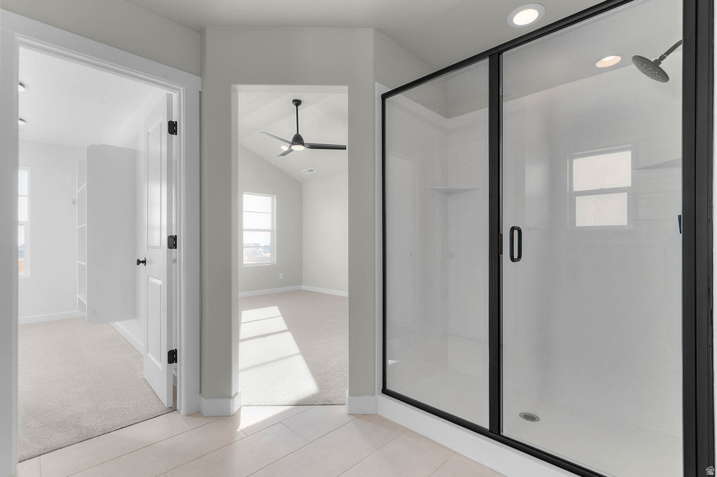 Black-framed glass shower enclosure with a rainfall showerhead