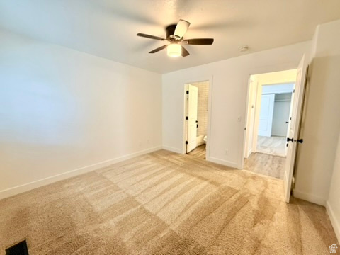 Carpeted interior room with white walls